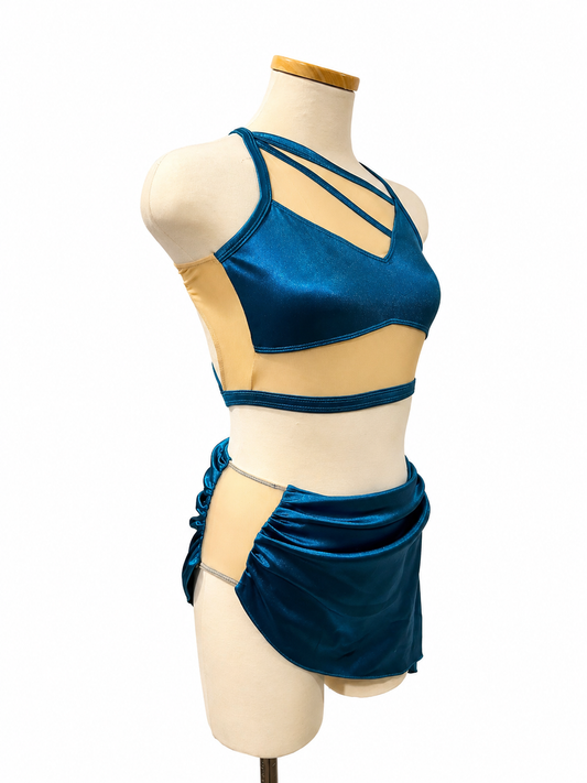 Side view of Alicia Base dance costume featuring satin skirt and strappy competition design