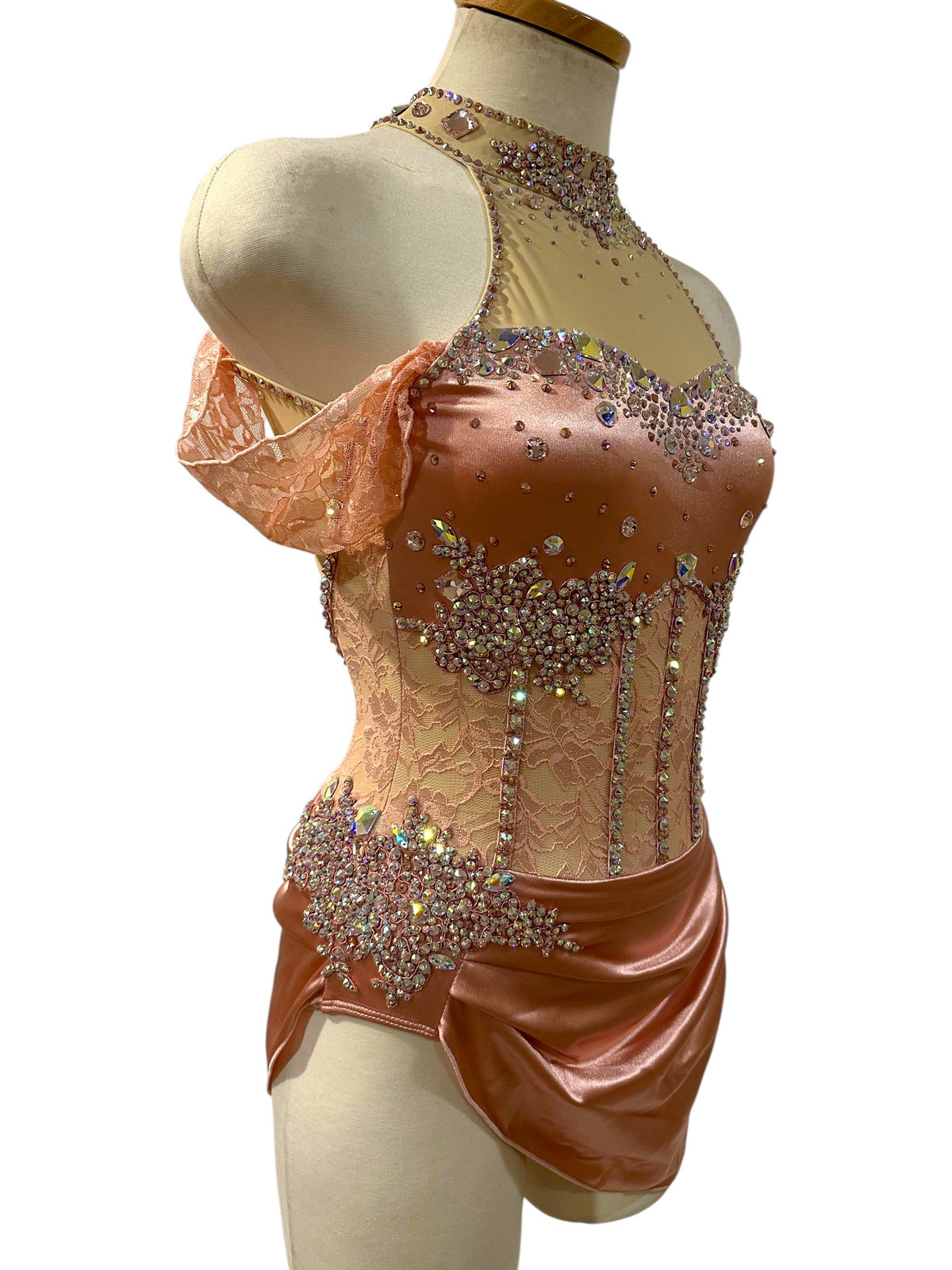 Gwendolyn Powder Rose Ready-to-Ship dance costume angled view with crystal embellished bodice, lace detailing and satin skirt