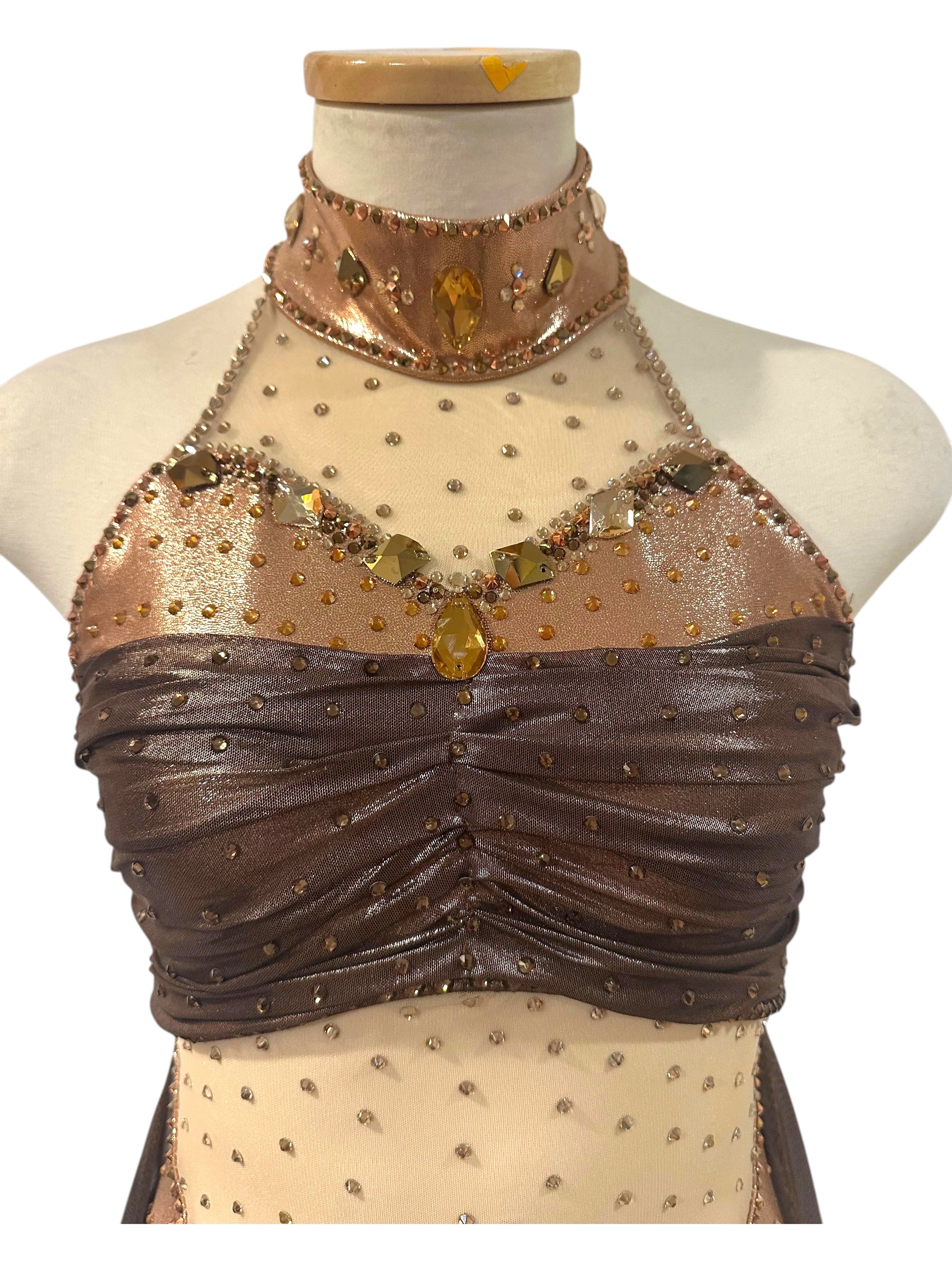 Close-up of the Aurora Signature Ready-to-Ship costume showing the ruched metallic bodice, crystal neckline, and hand-applied embellishments.
