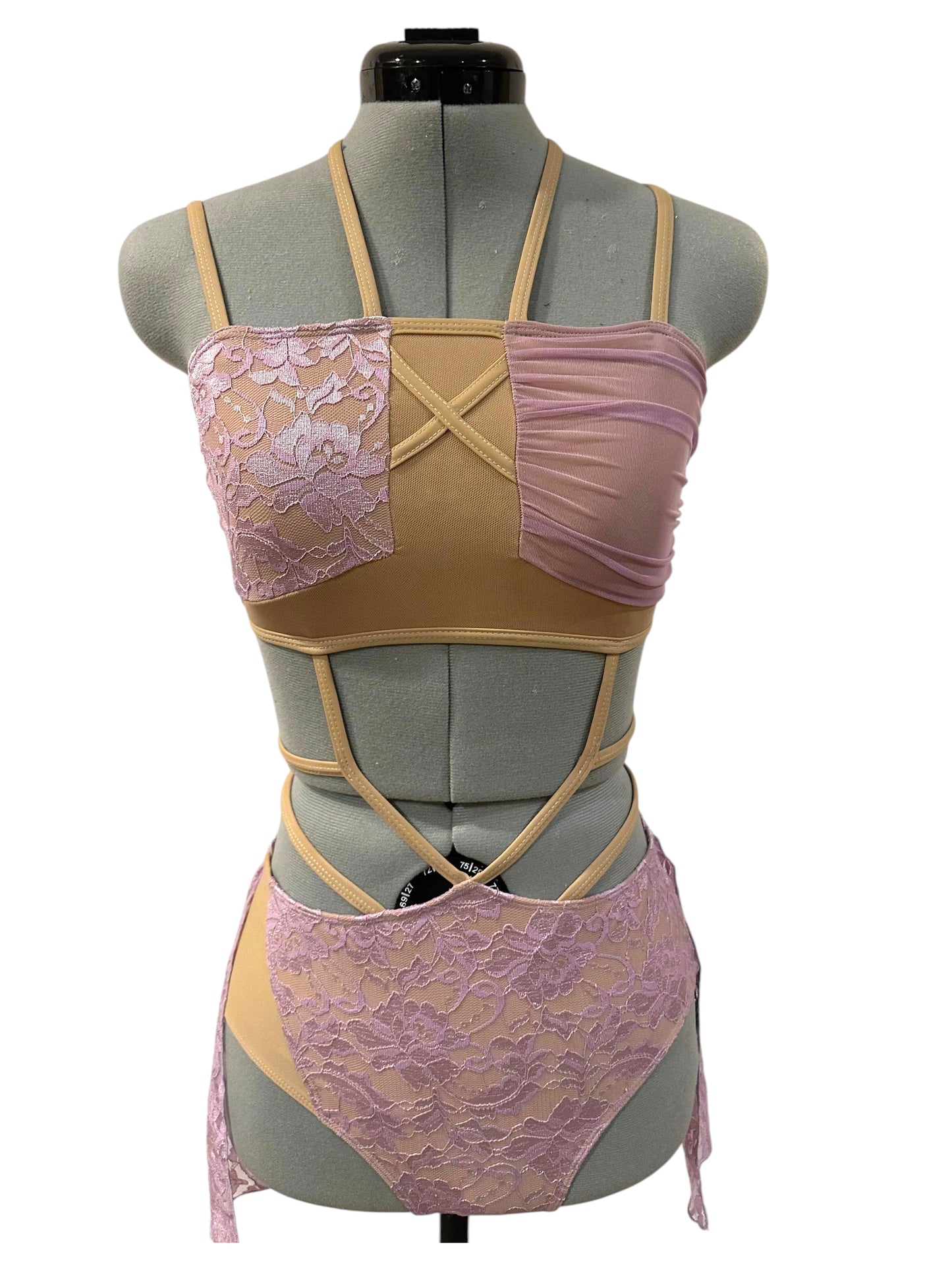 Ava dance costume base in Lavender with wrap-style lace bodice, nude illusion panels, and dramatic cutout competition design
