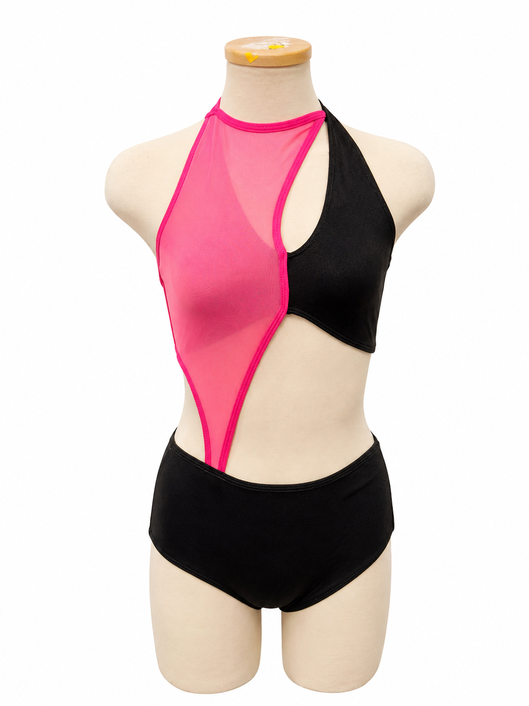 Vita Base dance costume in hot pink and black featuring dramatic asymmetrical color blocking, high neckline, and contemporary cutout design front view