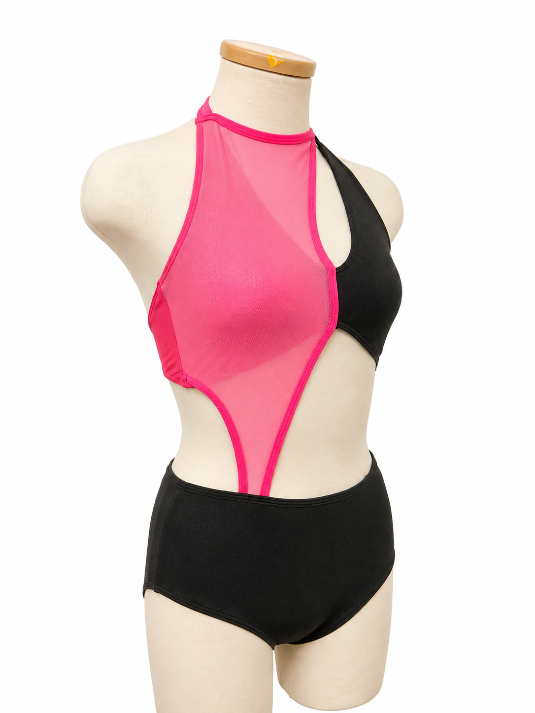 Vita Base contemporary dance costume angled view showing bold color blocking, side cutout detail, and high-neck silhouette