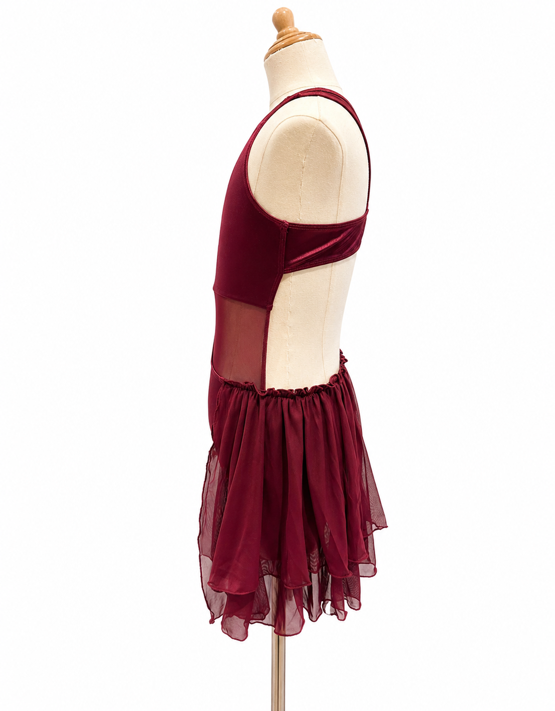 Profile view of Gianna Base dance costume with asymmetrical silhouette and mesh detailing