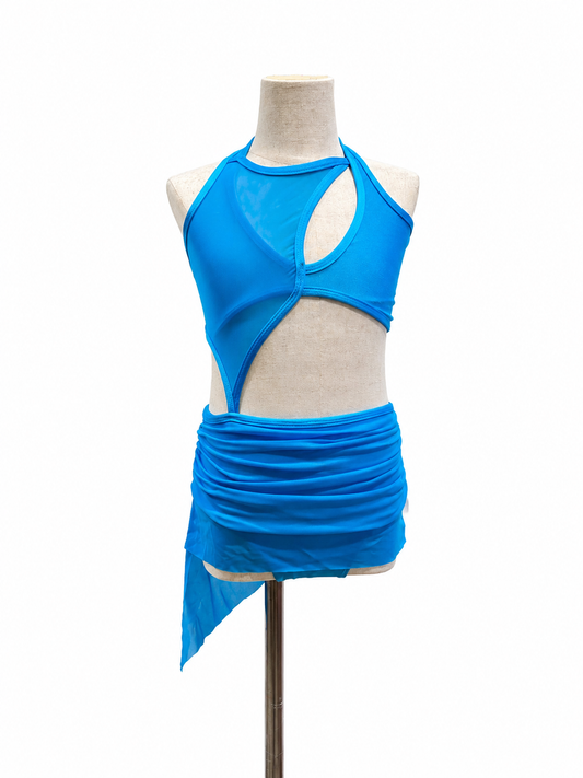 Kristie Base competition dance costume featuring asymmetrical styling and dramatic front cutout details