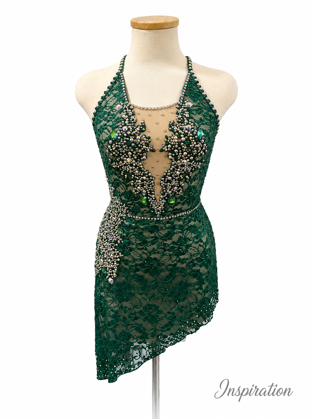 Emerald Green Lace Dance Costume Inspiration with rhinestone embellishments, nude illusion detail, asymmetrical skirt, and open back styling
