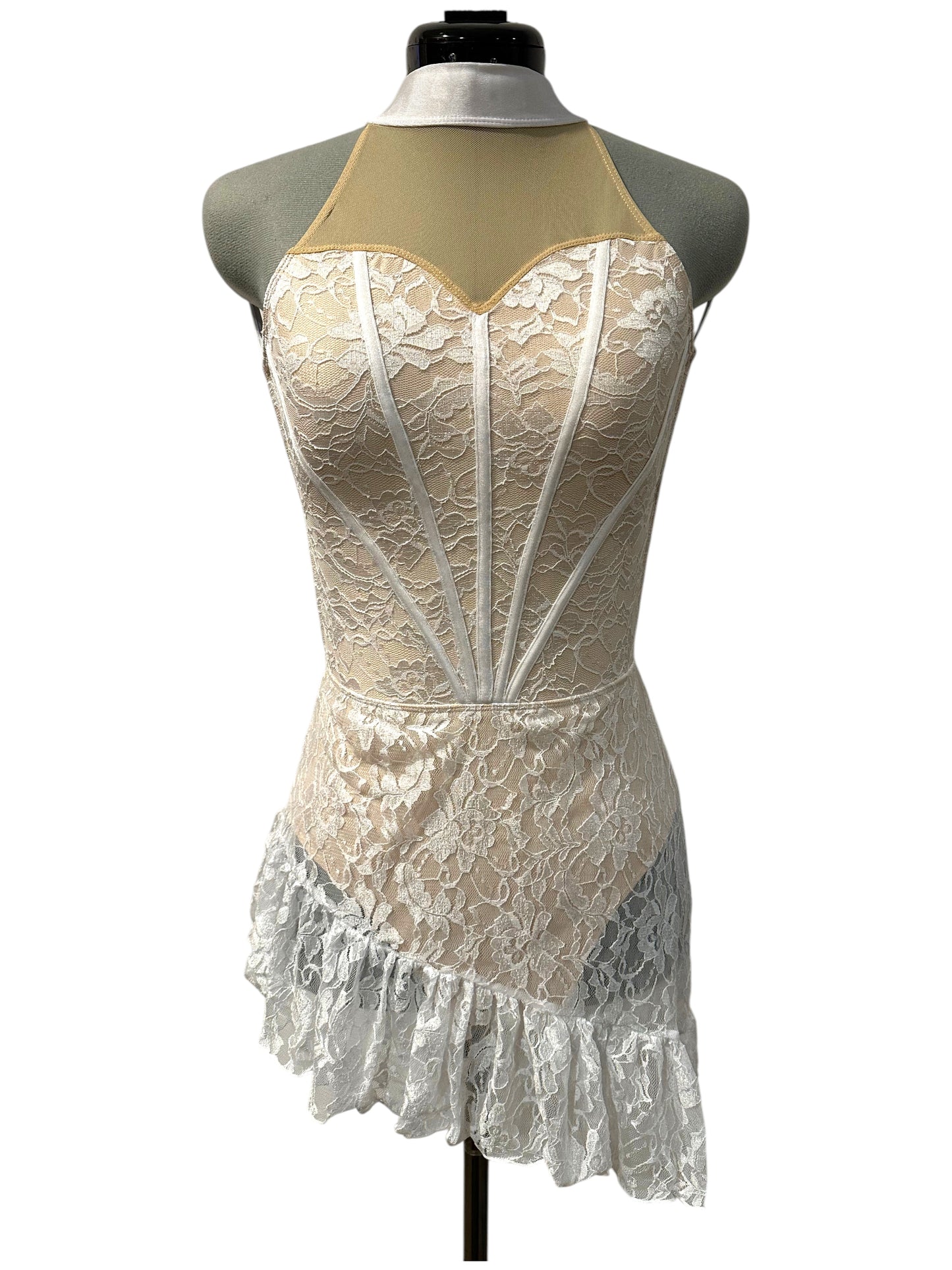 White lace Demi dance costume base with illusion high neckline, satin piping, open back straps, and asymmetrical lace ruffle skirt – front view.