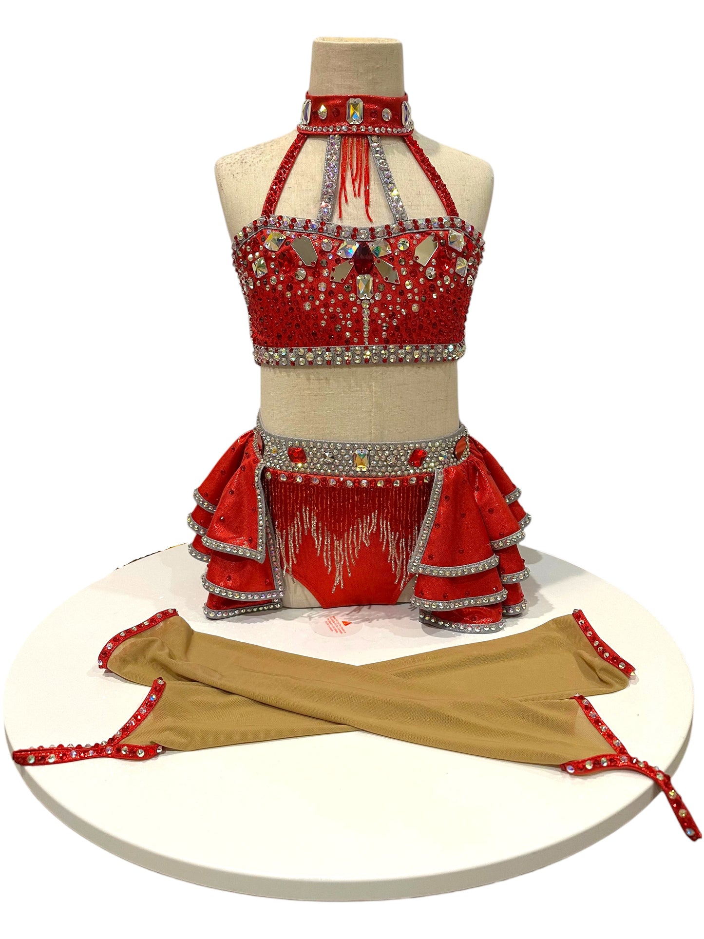 Elite Designs by Dawn Kiki Ready-to-Ship dance costume displayed with matching detachable arm sleeves in red metallic fabric with silver crystal embellishments.