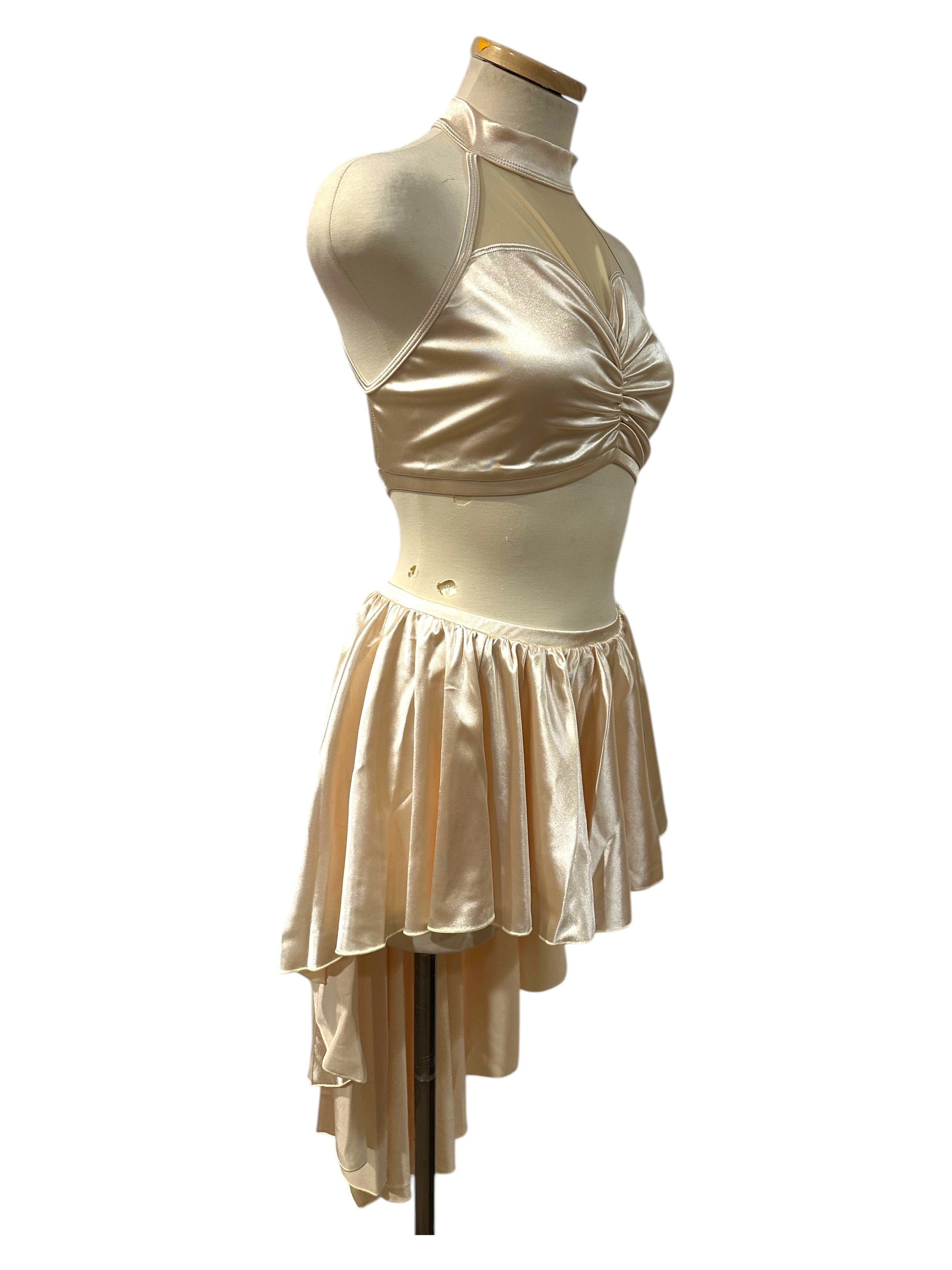 Side view of The Aubrey Base satin dance costume featuring a gathered sweetheart bodice and layered asymmetrical skirt.