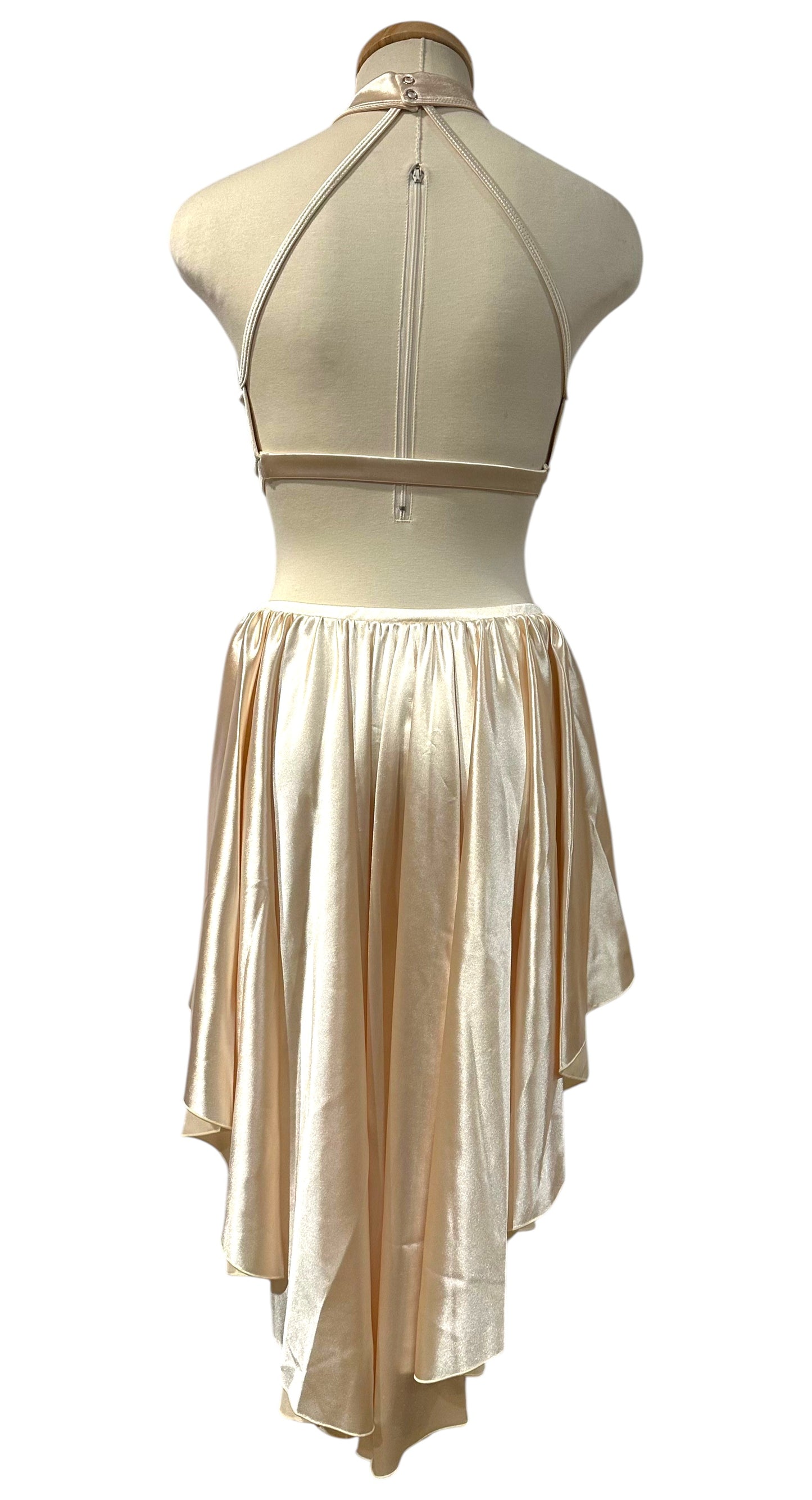 Back view of The Aubrey Base showing the open-back halter design and flowing layered satin asymmetrical skirt.
