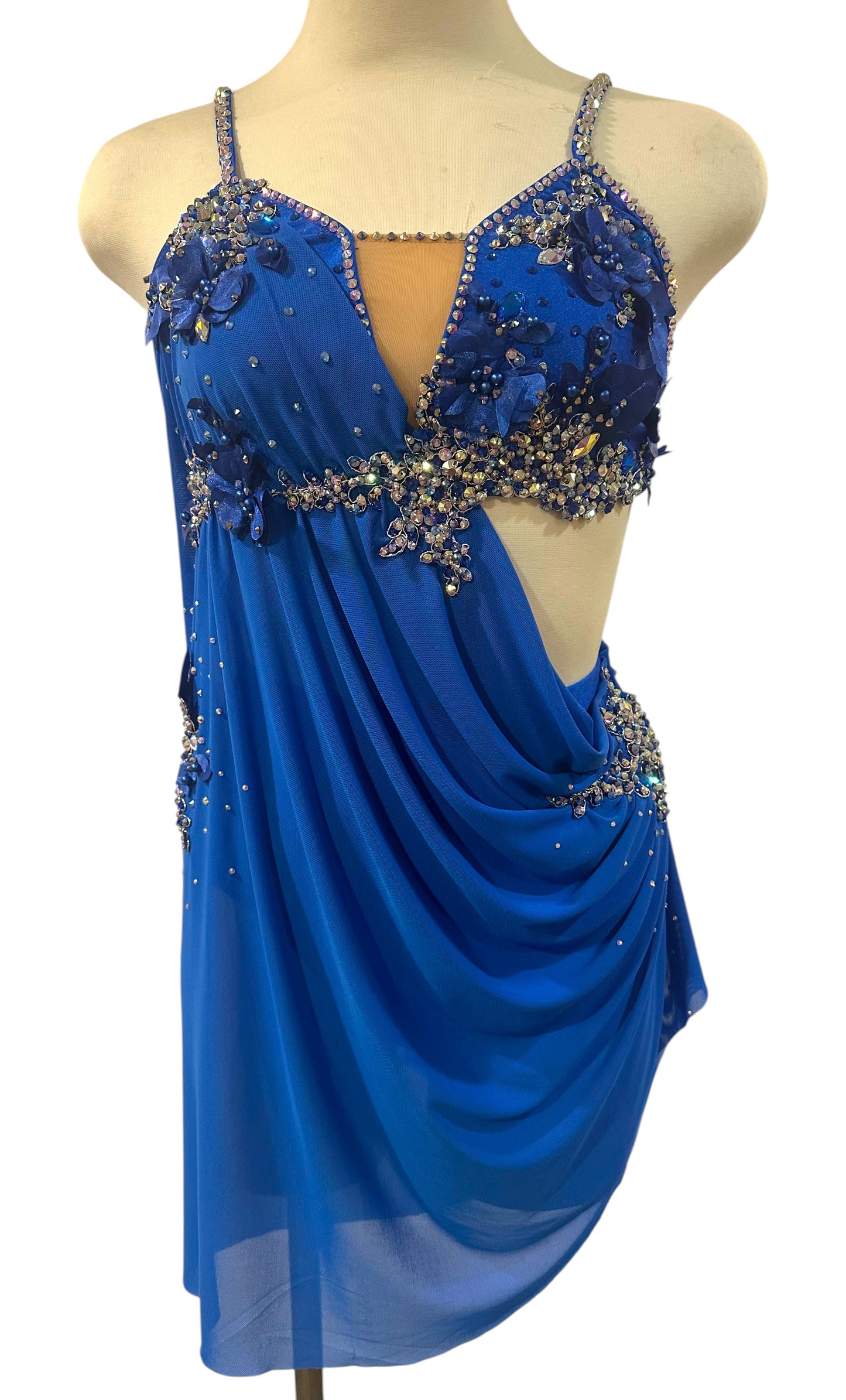 Royal blue rhinestone lyrical dance costume front view featuring flowing mesh draping, crystal embellishments, and floral appliqués.