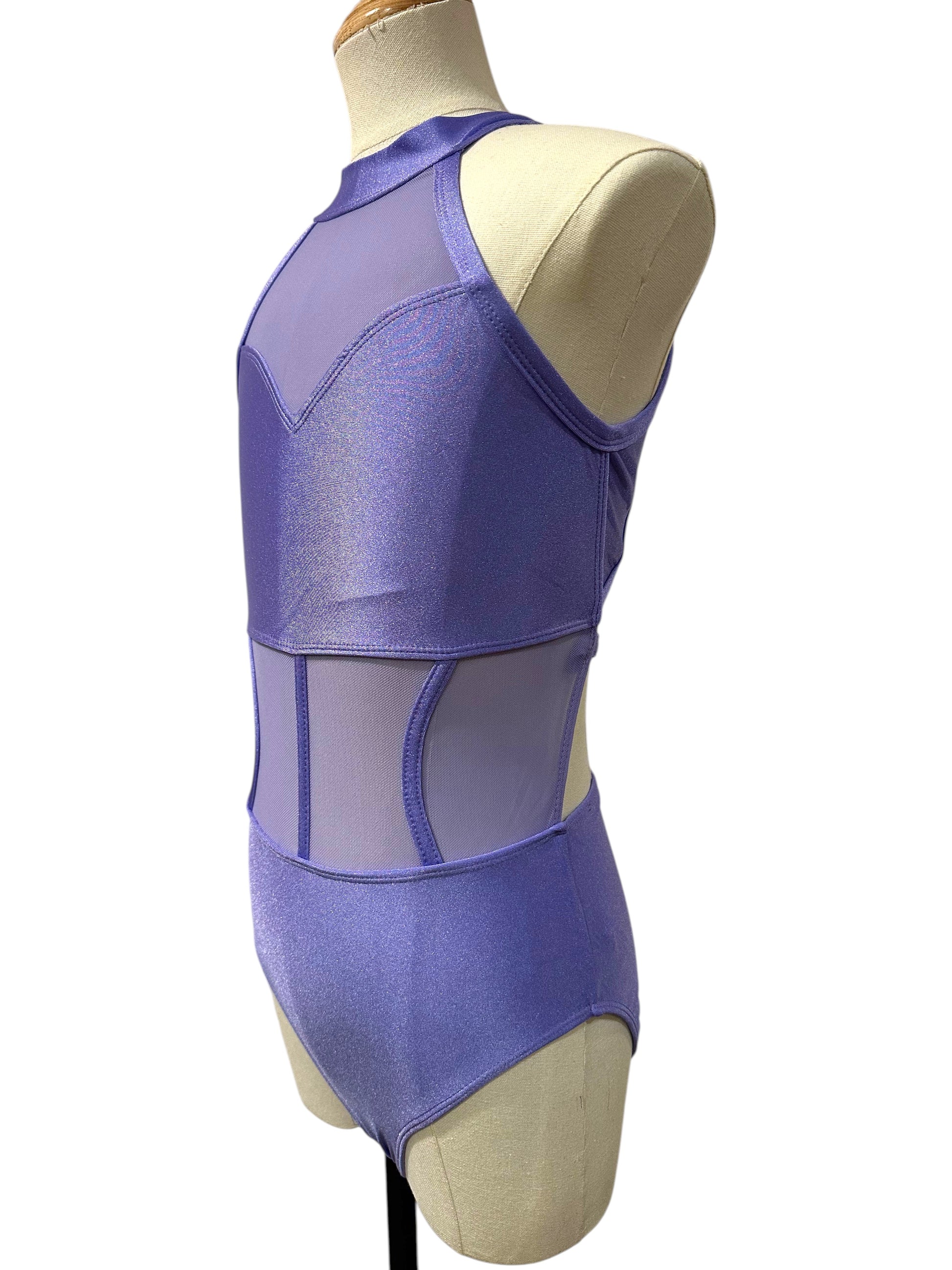 Left side view of the purple Shanna Base Studio Collection dance costume base featuring illusion mesh side panels and a modern halter design.
