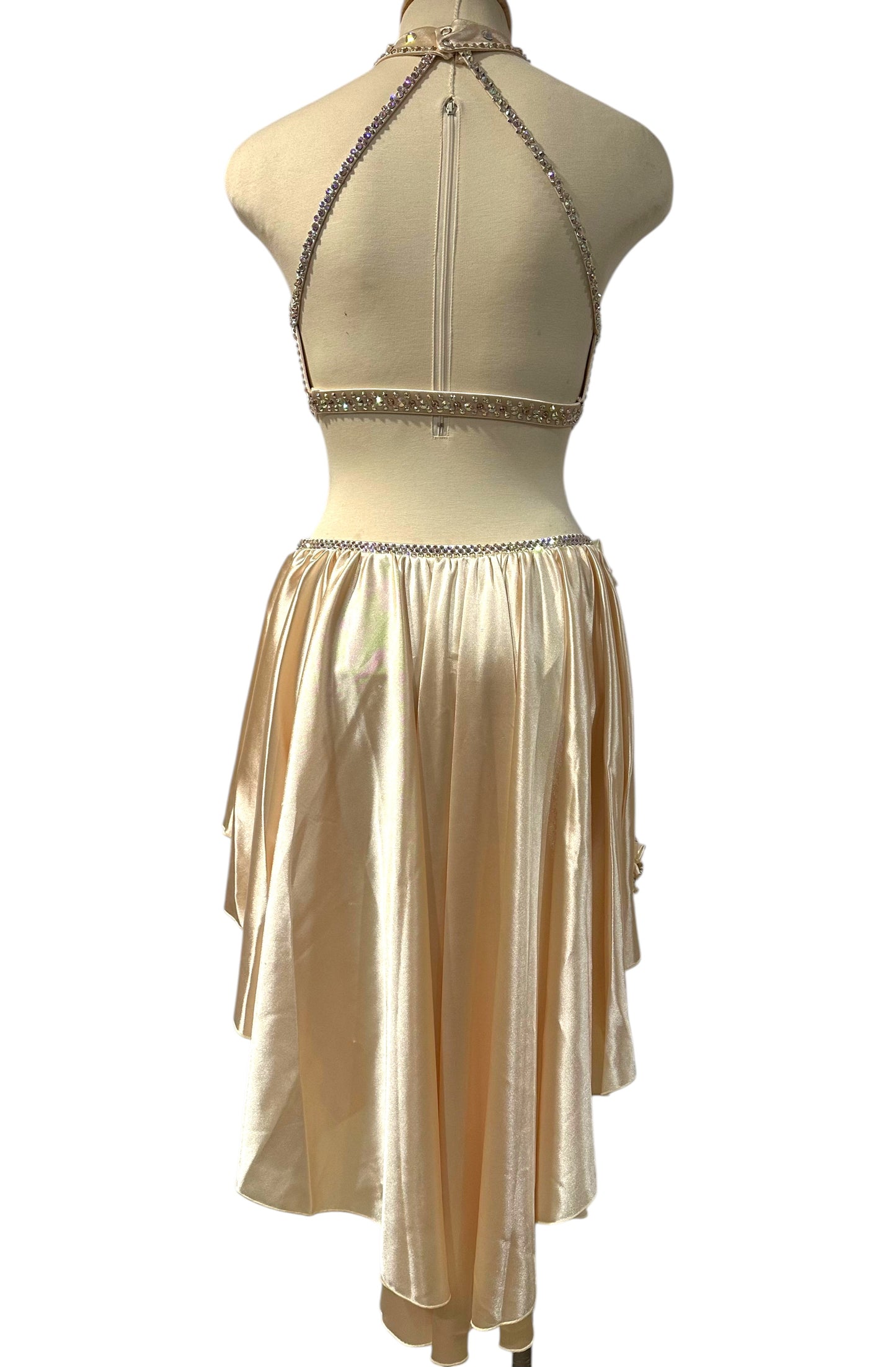 Back view of the Aubrey Ready-to-Ship dance costume featuring an elegant open-back halter design with rhinestone trim and a flowing asymmetrical skirt.