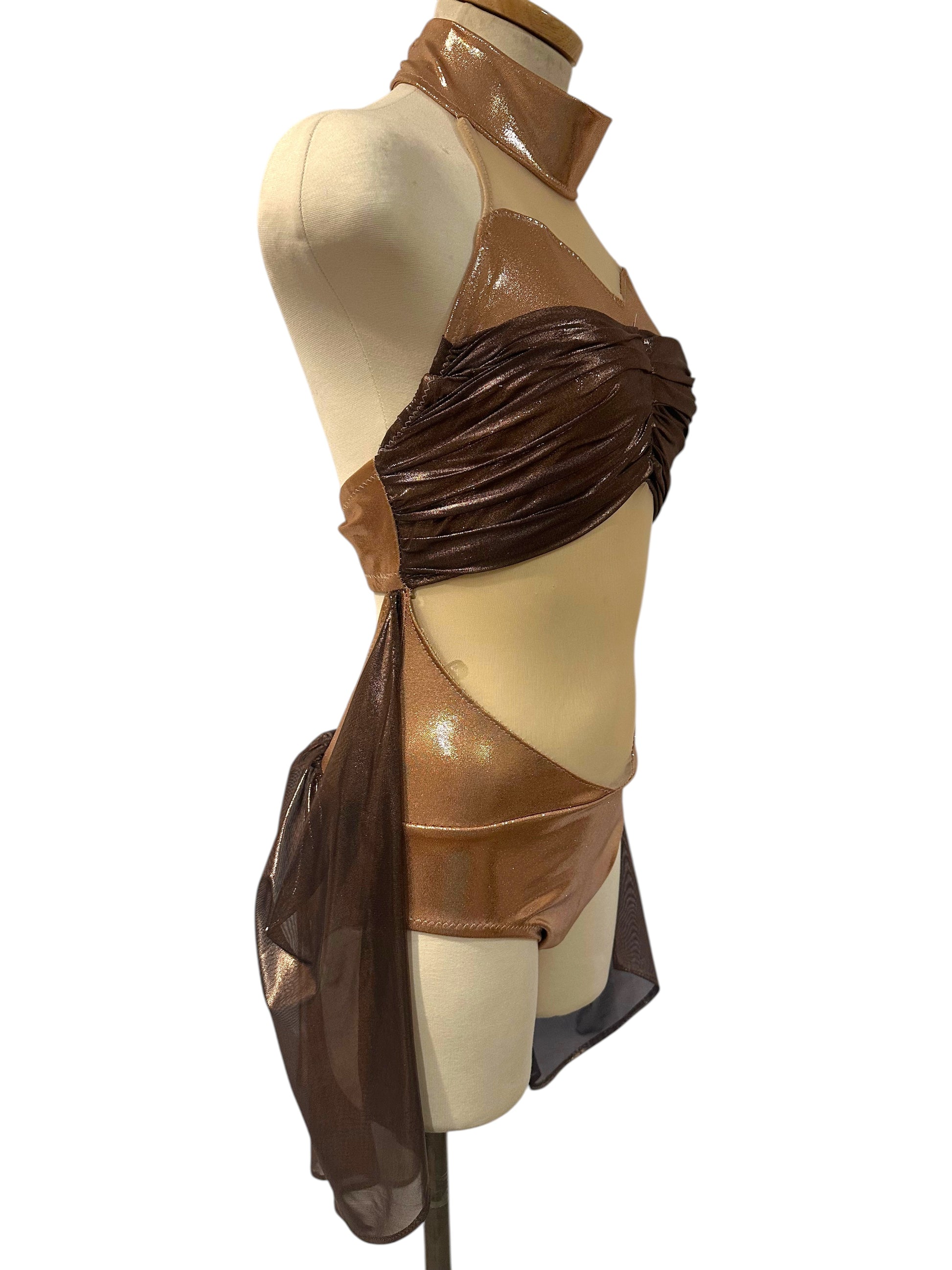 Right side view of the Aurora Signature Base featuring metallic copper and brown fabrics with flowing mesh detail.