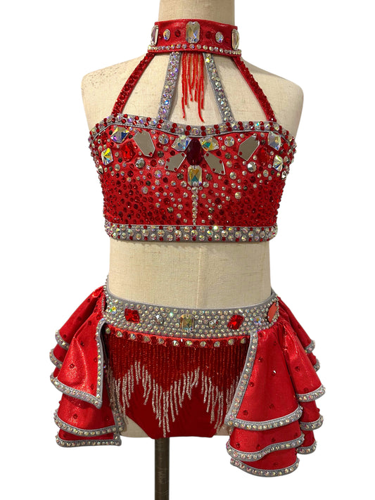 Front view of Elite Designs by Dawn Kiki Ready-to-Ship dance costume in red metallic fabric with silver crystal embellishments, layered ruffles, and detachable arm sleeves.