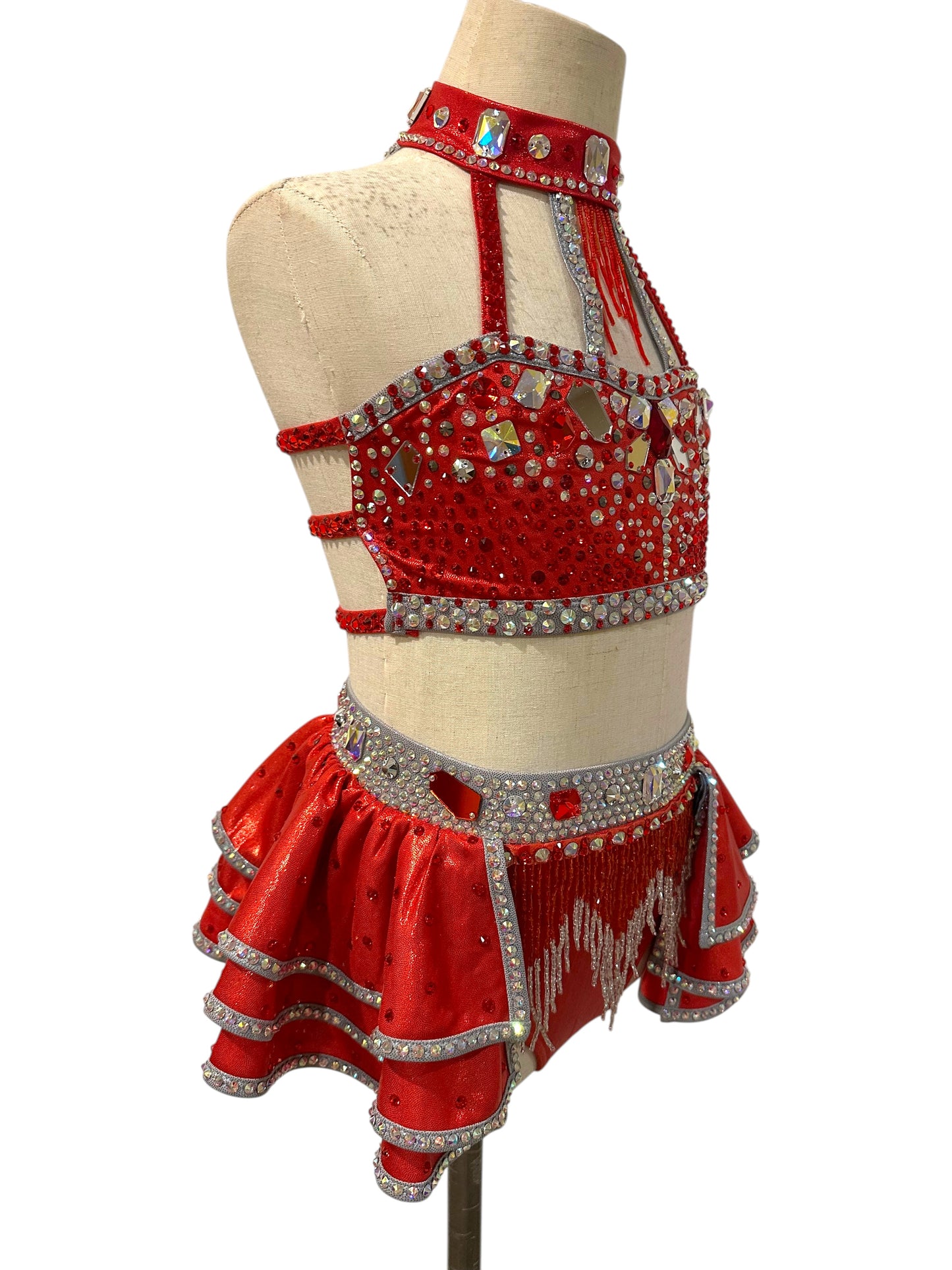 Right side view of the Kiki Ready-to-Ship dance costume showing layered ruffles, strappy open back, and crystal detailing.