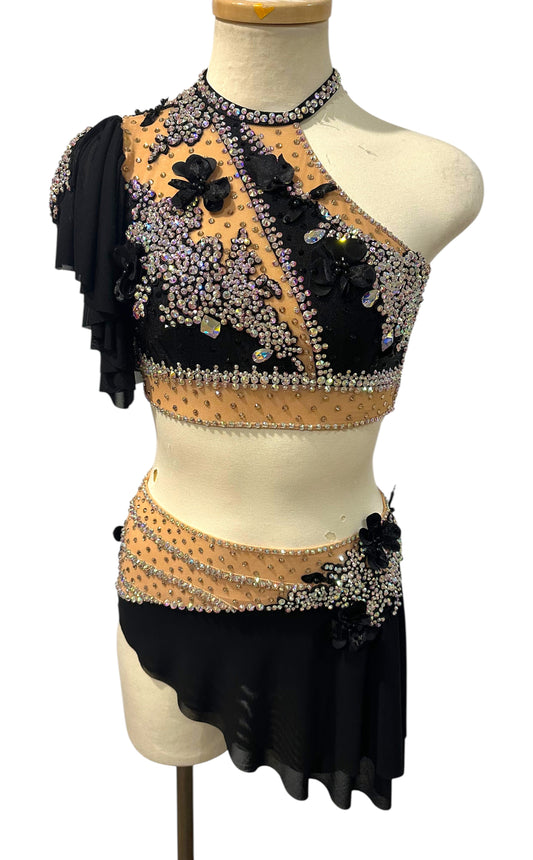Scarlett Ready-to-Ship black and nude dance costume with crystal embellishments, floral appliqués, and asymmetrical mesh skirt.