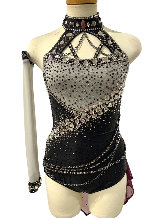 Ready-to-Ship Adult Small black, silver and burgundy dance costume with crystal embellishments, chain details, detached sleeve and asymmetrical mesh drape.