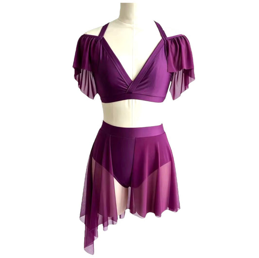 Kaliya Signature dance costume base in eggplant featuring crossover crop top, off-the-shoulder mesh sleeves, high-waisted briefs, and asymmetrical mesh skirt.