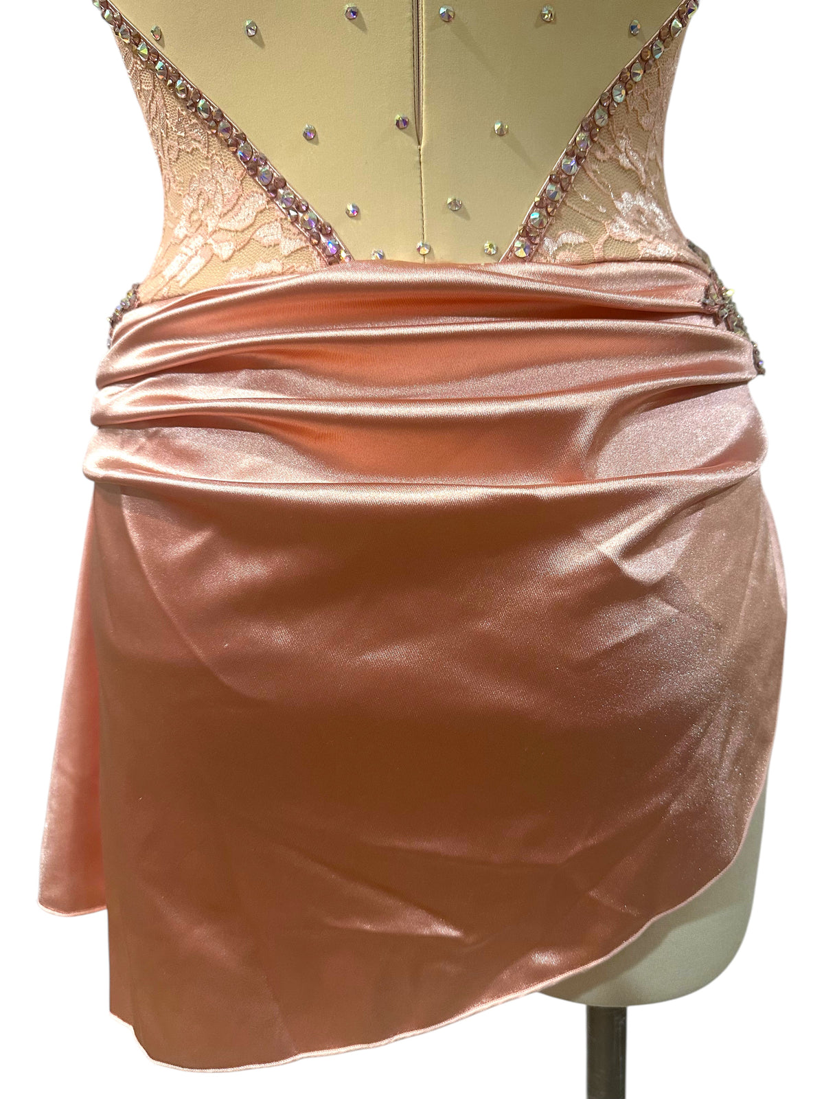 Gwendolyn Powder Rose dance costume back detail showing draped satin asymmetrical skirt and rhinestone trimmed lace panels