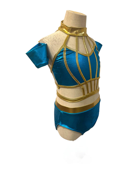 Angled view of Savy metallic dance costume base in River Blue and Light Gold with geometric illusion bodice and high-waisted briefs