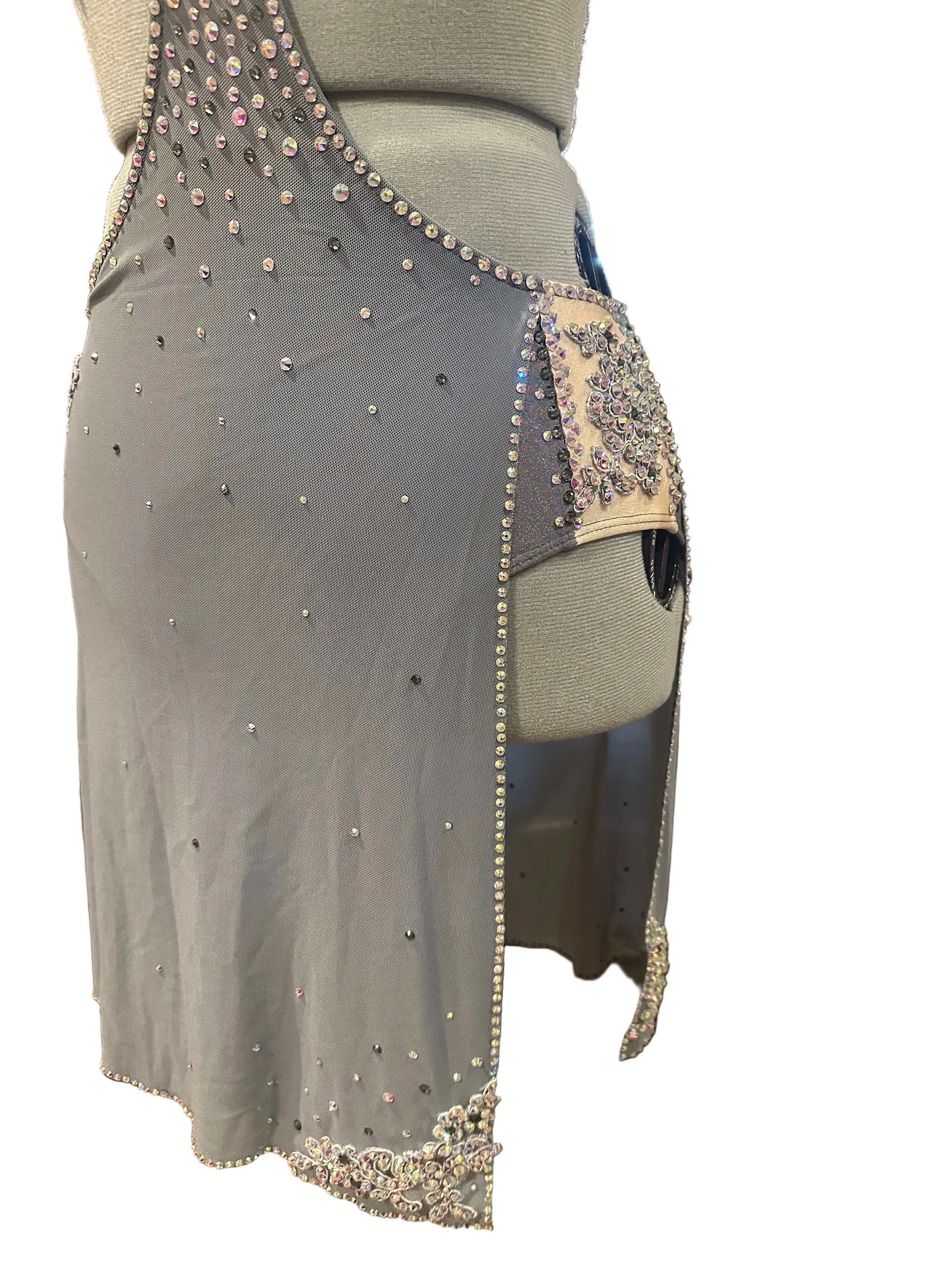 Gray dress with rhinestone embellishments on a mannequin