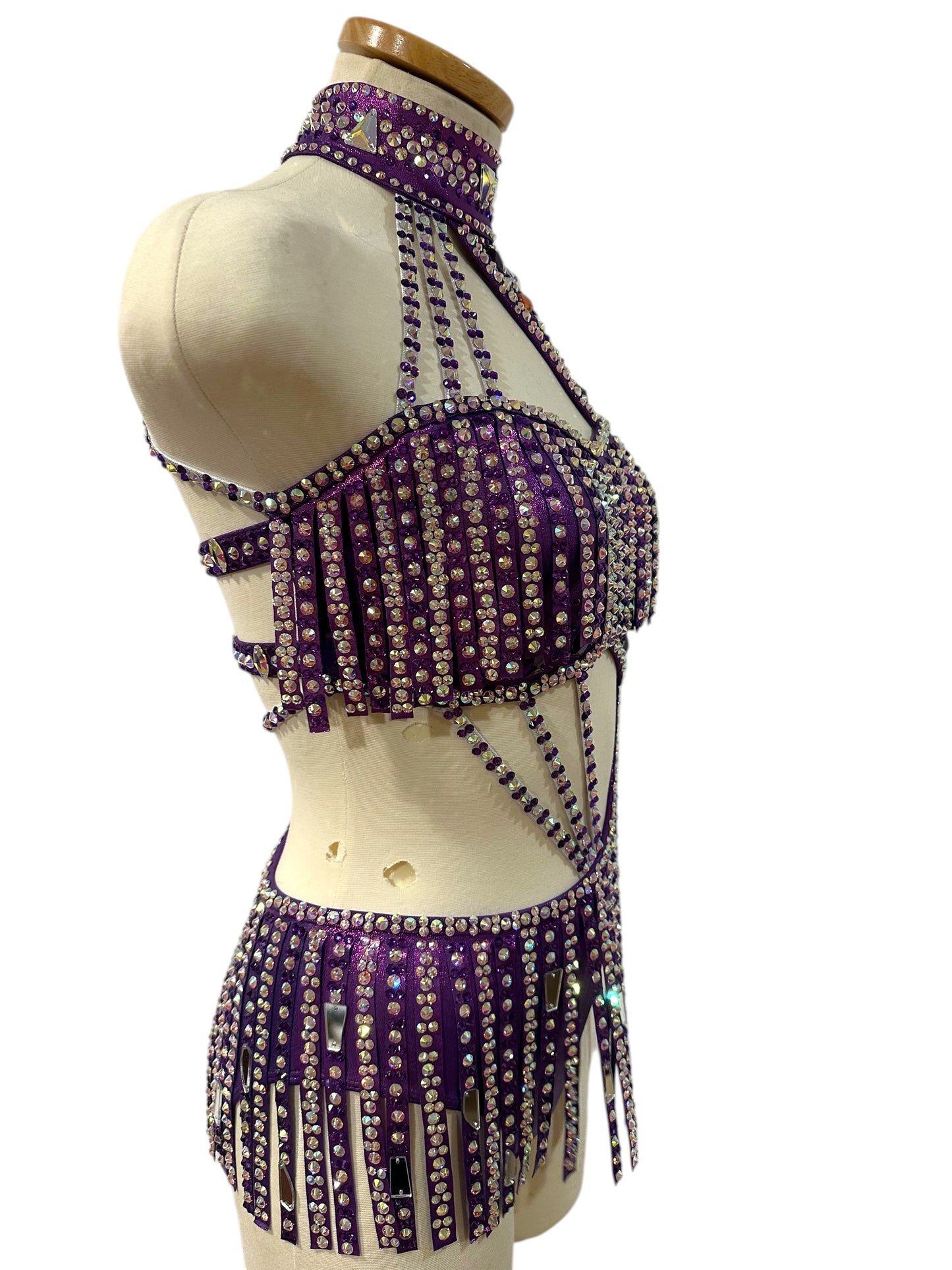 Right Side view of ready-to-ship hologram purple dance costume with rhinestone detailing, mirror accents, and dramatic cutout silhouette.