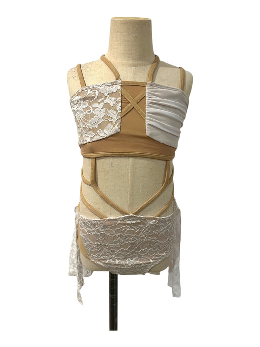 Ava dance costume base with wrap-style lace bodice, nude illusion panels, and dramatic cutout competition design