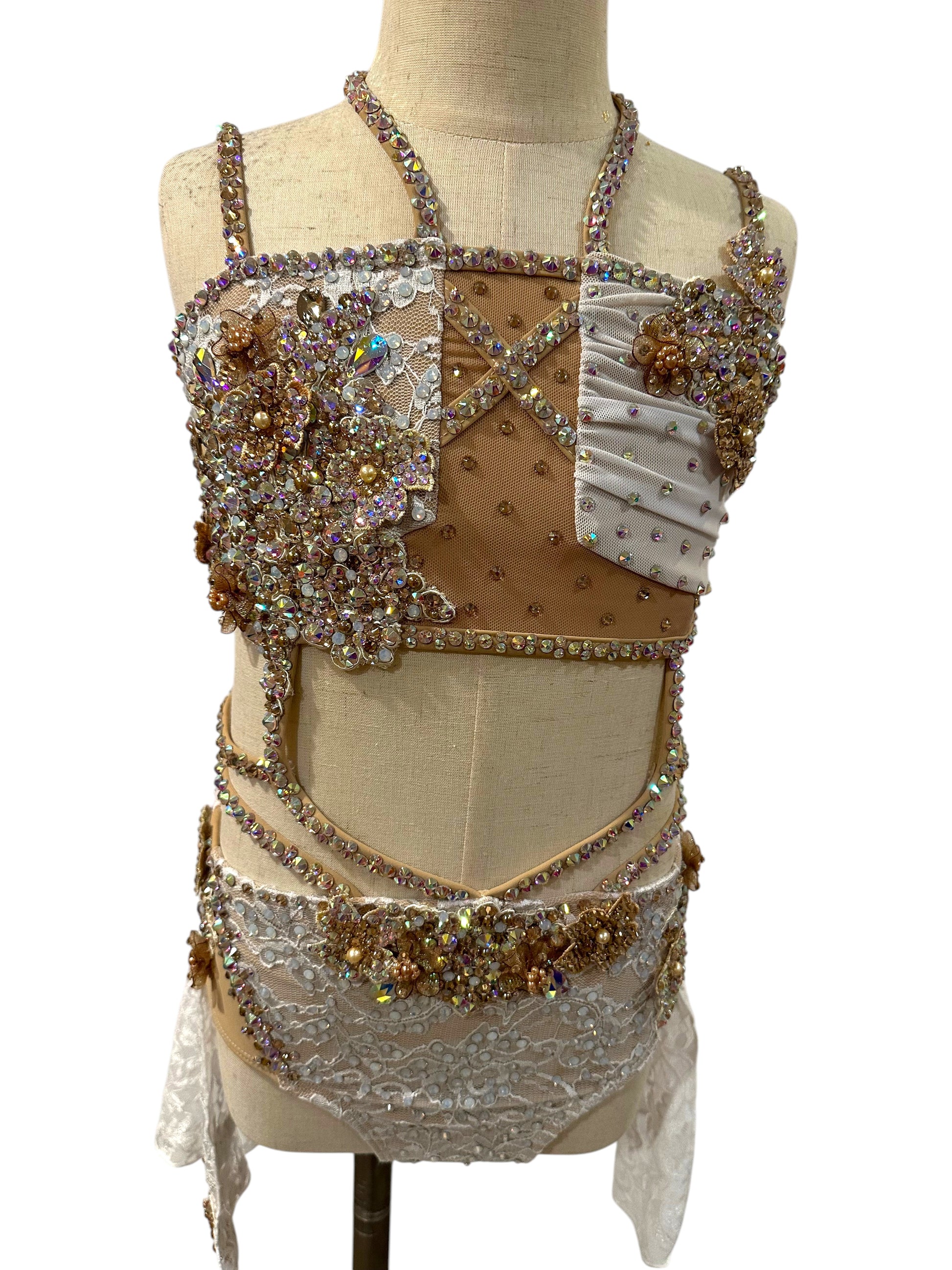 White lace competition dance costume with rhinestone appliqué and nude mesh detailing front view