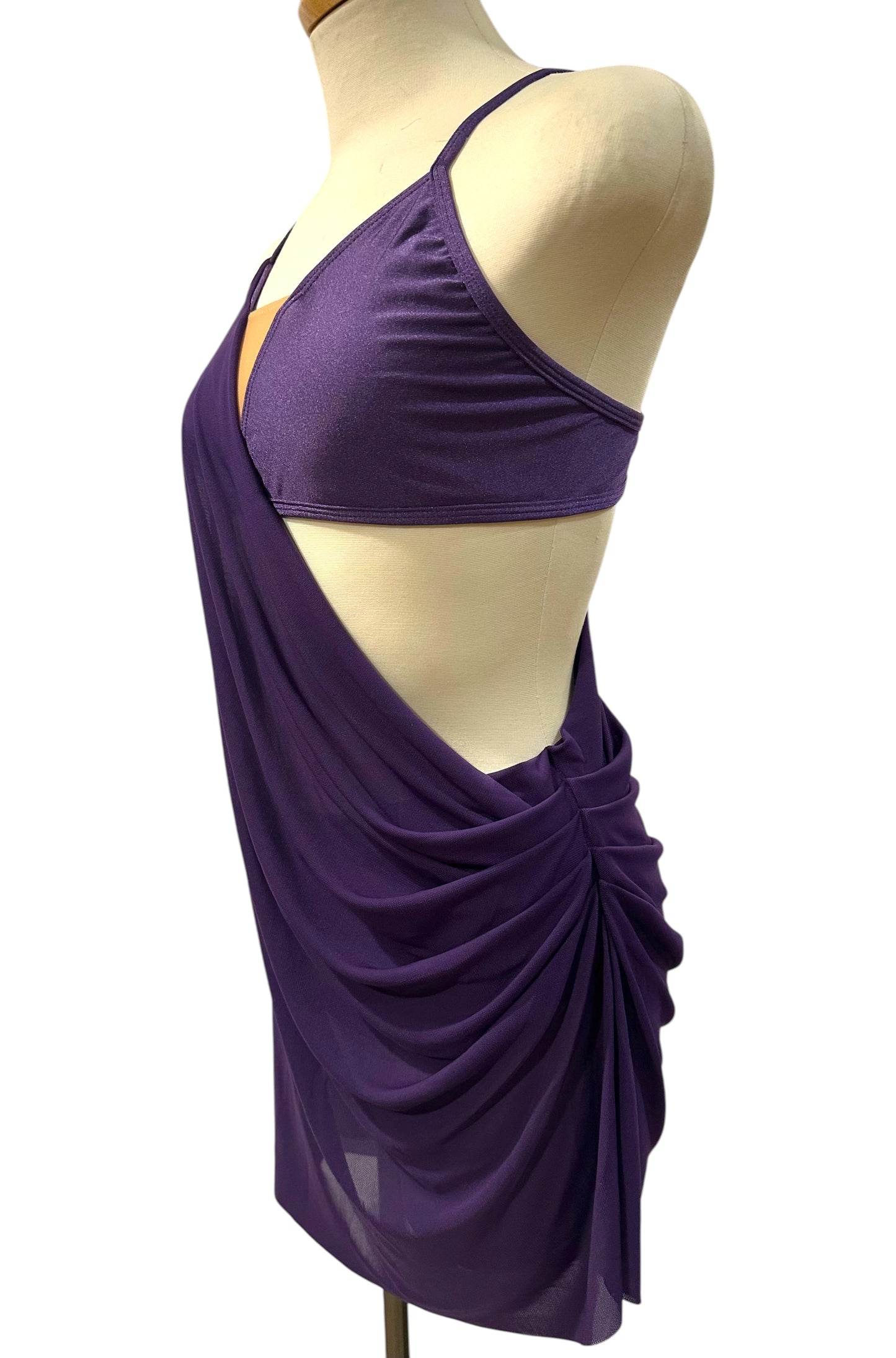Indira Base dance costume side view showing dramatic mesh draping, open side detail, and contemporary performance silhouette.