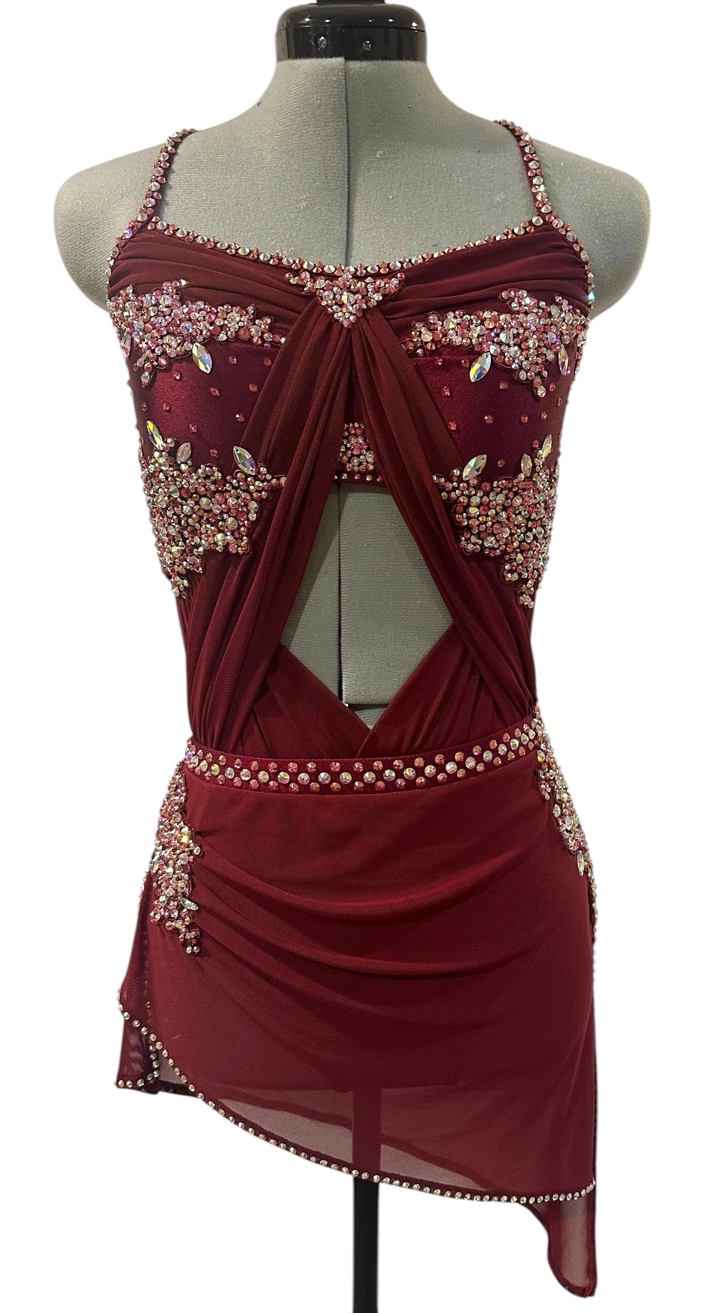 Ready-to-ship burgundy rhinestone dance costume in Adult Medium featuring a dramatic front cutout, draped crisscross bodice, and asymmetrical skirt