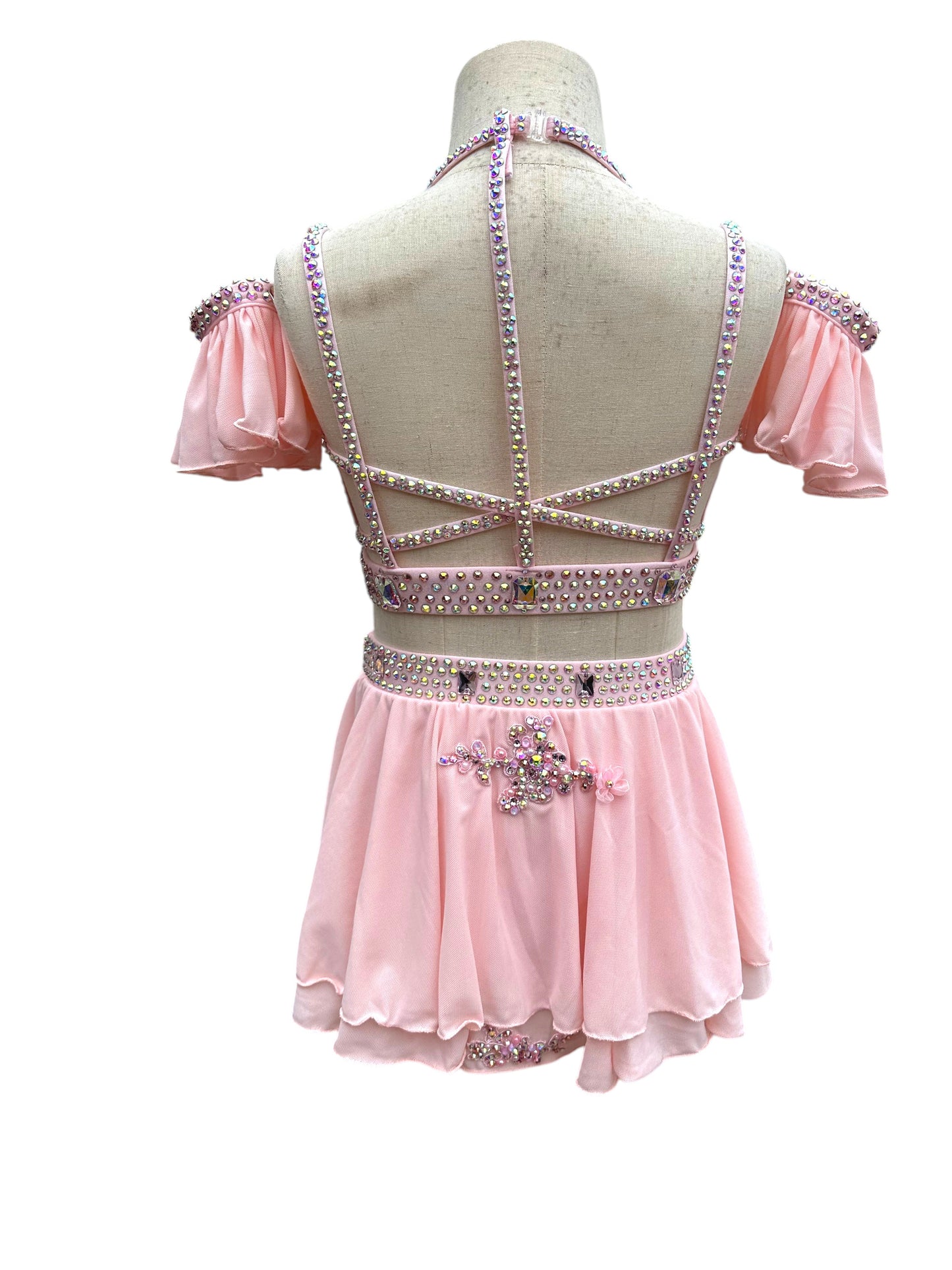 Back view of blush pink rhinestone dance costume with strappy open back design
