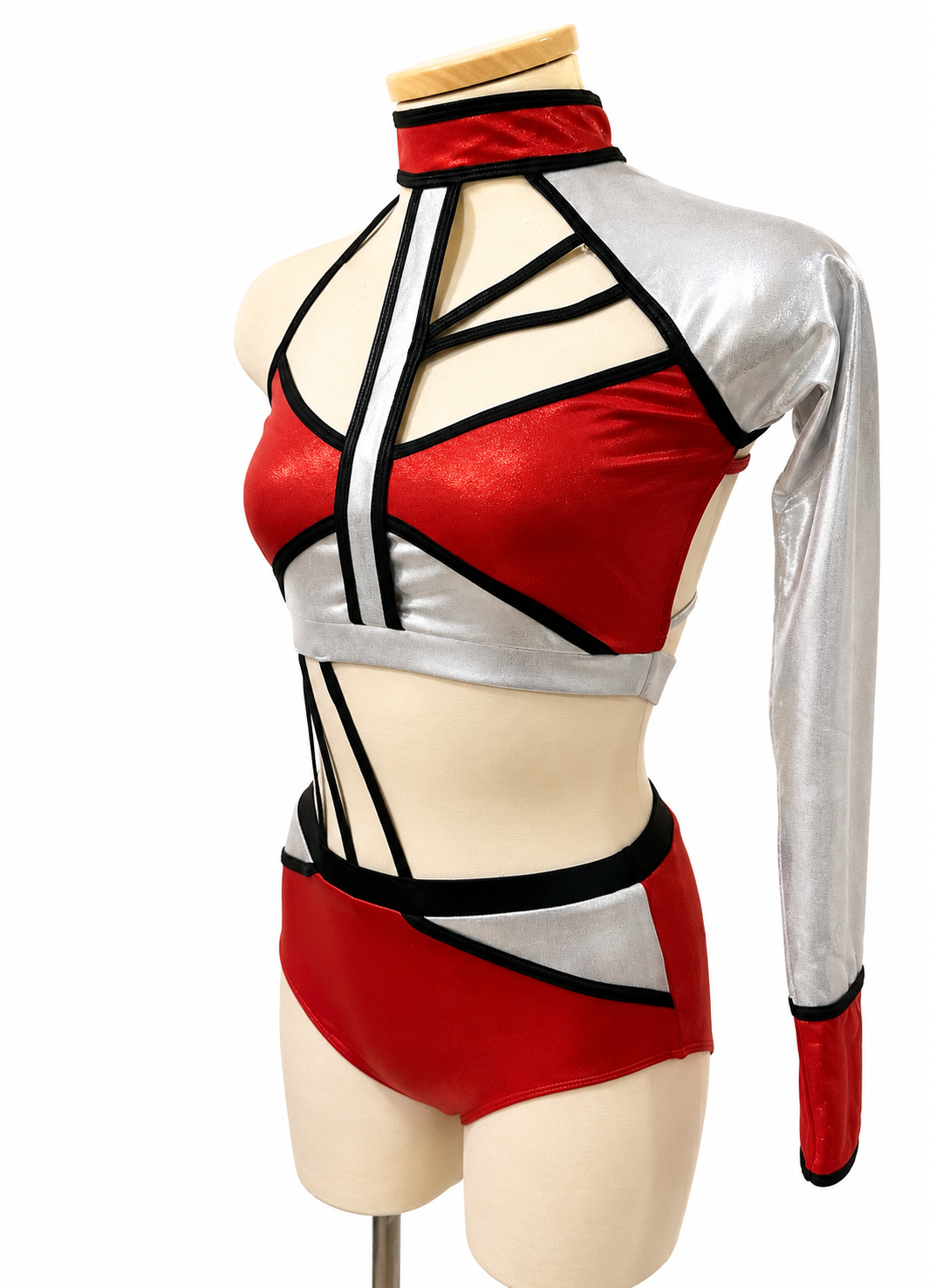 Side angled view of the Lauri Base in Metallic Red, Black, and Silver showing the one-sleeve design, open cutouts, and high-waisted briefs.