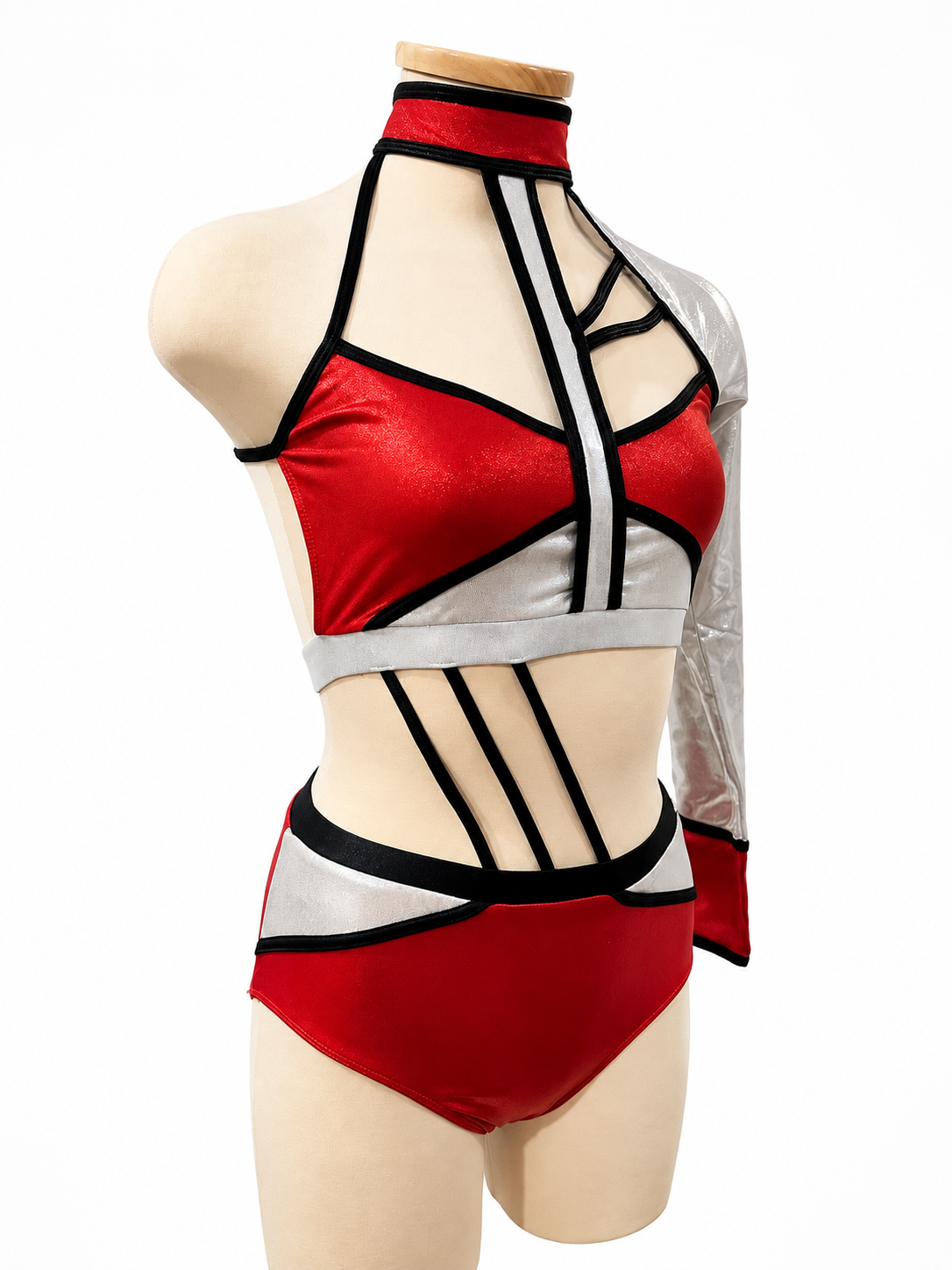 Angled front view of the Lauri Base in Metallic Red, Black, and Silver with asymmetrical neckline, metallic silver sleeve, and geometric detailing.