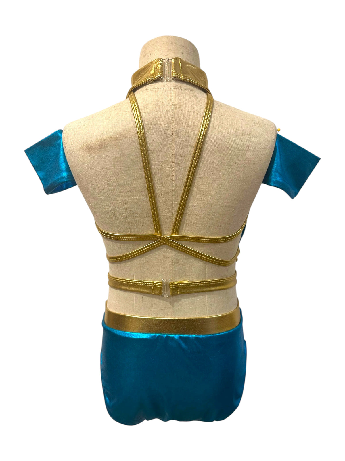 Back view of Savy two-piece metallic dance costume base in River Blue and Light Gold with open strappy back and matching briefs
